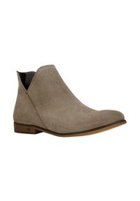 Beige Wildleder-Ankle-Boot mit spitzem Zehenbereich und seitlichen Ausschnitten. Niedriger Holzabsatz und strukturierte Oberfläche. Schlichtes, elegantes Design.