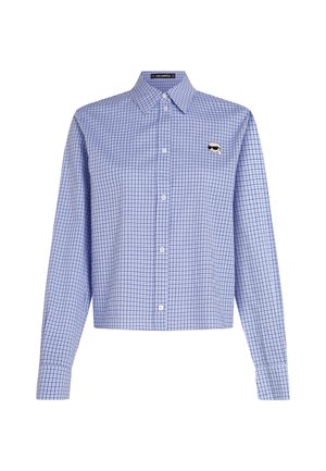 Zils un balts šaurais kreklis ar garām piedurknēm un norādītu apkakli, ar logotipa uzlīmi kreisajā krūtī, pogas frontē.