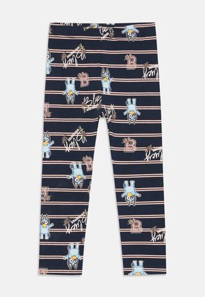 Leggings blu navy con un design giocoso che presenta personaggi dei cartoni animati blu, strisce rosa e dettagli testuali bianchi. Realizzati in un morbido tessuto elastico.