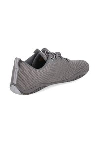 Aerated gray shoe with a textured mesh upper, rubber sole, and elastic laces. Features a pull tab and minimalist design for comfort.