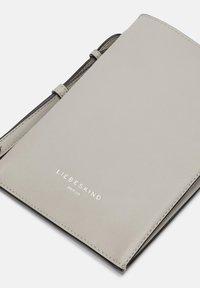 Grey leather notebook cover with a textured finish, featuring a debossed logo "LIEBESKIND" and black accents along the spine.