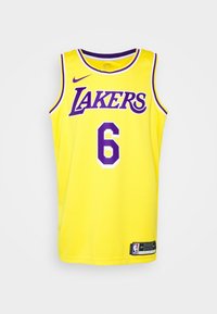 Žlutý basketbalový dres s nápisem "LAKERS" fialovou barvou, číslem "6" v bílé a fialové, bez rukávů, s logem Nike dole.