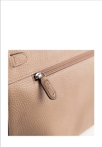 Beige leather bag with textured surface, featuring a brown zipper, and a tag embossed with "PICARD" attached to the zipper pull.