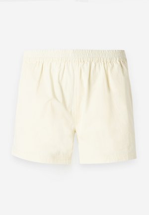 Šviesiai geltoni medvilniniai šortai su elastinga juosta, pasižymintys laisvu siluetu ir lygiu paviršiumi, be matomų raštų ar akcentų.