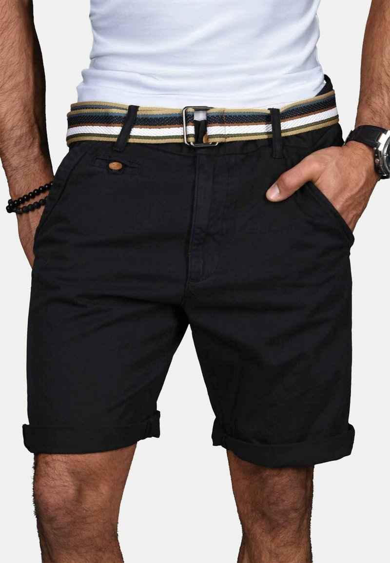Black cotton shorts with rolled hems, featuring a multicolored woven belt and front pockets. Simple design, durable material, and casual fit.