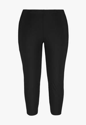 Schwarze Leggings aus glattem, dehnbarem Stoff, mit einer taillierten Passform, die bis zur Mitte der Wade reicht, und einem elastischen Bund.