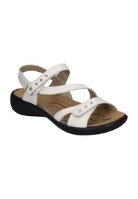 White strappy sandals with a synthetic upper, cushioned footbed, black sole, and decorative metal studs on the straps. Open-toe design.