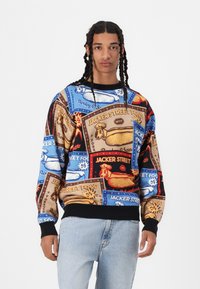 Sweatshirt featuring a multicolored collage of food-themed graphics on a blue background. Made from fabric with ribbed cuffs and hem.