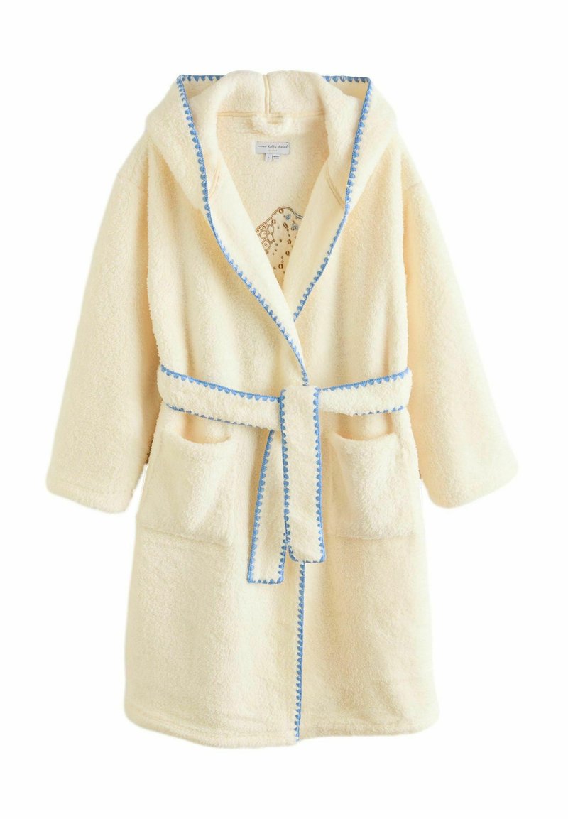 Krēmkrāsas peldmētelis no mīksta frotē auduma ar kapuci, zilu apdari, jostas saiti un priekšējām kabatām. Tam ir mīksts, teksturēts virspusējais slānis.