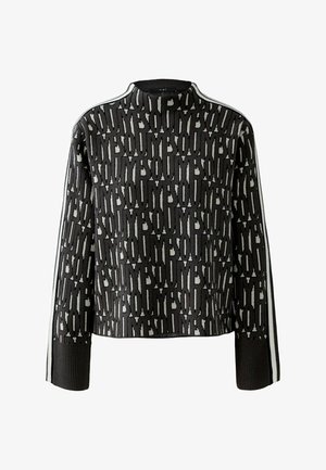 Gebreide coltrui in donkergrijs met een gedurfde zwart-witte print, geribde manchetten en witte zijstrepen. Zachte textuur, cropped fit.