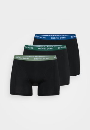 Schwarze Boxershorts im Dreierpack; jede mit einem charakteristischen Bund: blau, grün und schwarz mit dem Branding "BJÖRN BORG".