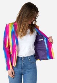 Colorful striped blazer featuring pink, yellow, blue, and green lines; lightweight material with a purple interior lining and branding detail.