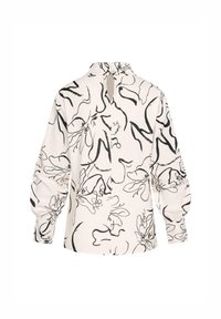 Blouse blanche à manches longues avec motifs floraux abstraits noirs en lignes, col montant avec fermeture à bouton goutte dans le dos, et poignets froncés.