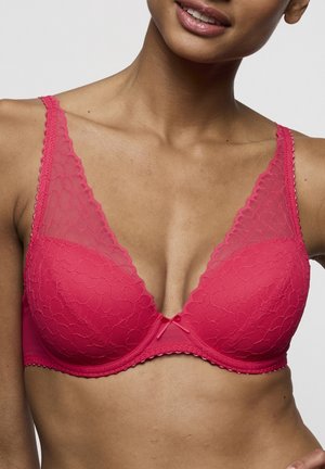 Roze kanten beha met bloemenpatroon, V-hals ontwerp, gladde cups en verstelbare bandjes. Voorzien van een klein strikje in het midden en een geschulpte rand.