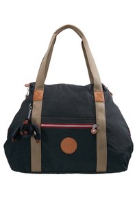 Sac en tissu noir avec des sangles beige, surface texturée, accent de fermeture éclair rouge et un emblème rond. Comprend un petit porte-clés en forme de singe.