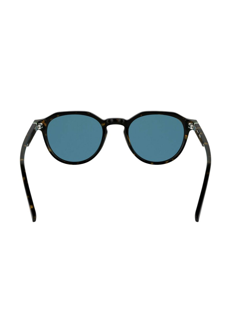 Lunettes de soleil à monture ronde avec un motif écaille de tortue, des verres bleus et des branches fines en plastique noir. Vue de face, matériel minimal visible.