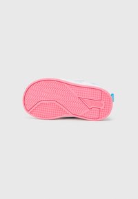 White sneaker sole with a pink rubber outsole. Features a textured pattern for grip and a blue accent on the heel. Reebok branding visible.