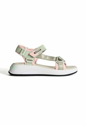 Green and pink sandal with adjustable straps, metallic accents, cushioned white sole, and black tread. Features logo on side.