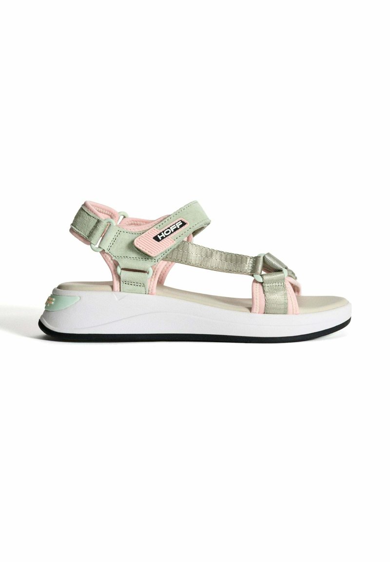 Green and pink sandal with adjustable straps, metallic accents, cushioned white sole, and black tread. Features logo on side.