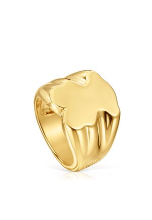 Anello signet in oro con un design a quadrifoglio liscio e arrotondato sulla parte superiore, finitura lucida e una fascia larga.