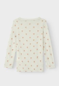 Langärmliges Oberteil aus off-white Stoff mit einem wiederholenden Muster kleiner, orangefarbener Schleifen. Weiche Textur mit rundem Ausschnitt und standardmäßiger Passform.