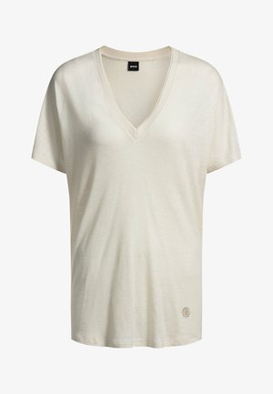Beige V-neck t-shirt made from soft fabric, featuring short sleeves and a subtle logo at the bottom left corner.