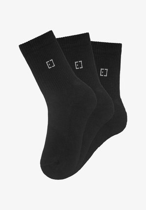 Black cotton socks in a pack of three. Features ribbed cuffs and a subtle logo detail in grey. Smooth texture and standard crew length.