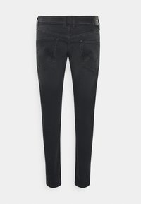 Musta farkkuhousut slim fit -mallilla. Ominaisuuksiin kuuluu viisi taskua, vyölenkit ja sileä pinta. Ei näkyviä kuvioita tai koristeita.