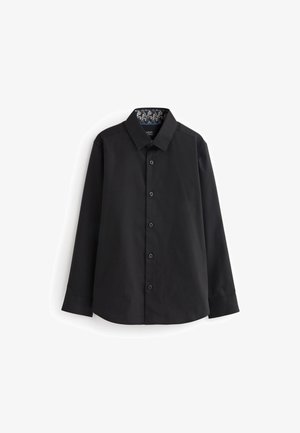 Chemise noire à manches longues avec boutons, doublure intérieure florale au col, col classique et manches bracelet, présentée sur fond blanc.
