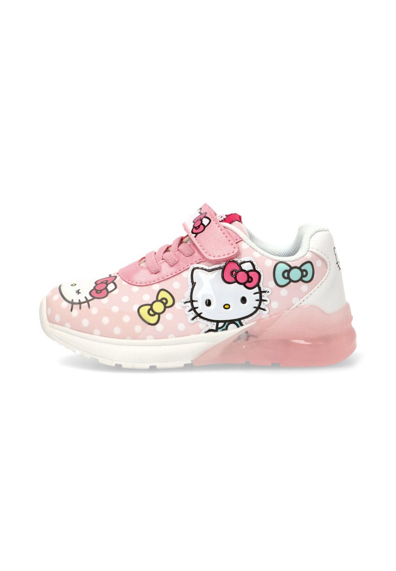 Zapatilla rosa con patrón de lunares, con gráficos de Hello Kitty y lazos coloridos. Incluye correa de velcro y suela transparente.