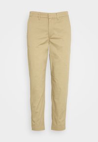 Chinos beiges en mélange de coton. Design ajusté avec une texture lisse, jambes droites et style à cinq poches standard.