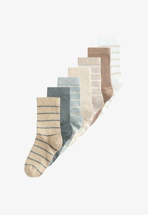 Set of eight pairs of socks in varying shades of beige, blue, and brown, featuring striped patterns and ribbed cuffs. Soft fabric texture.
