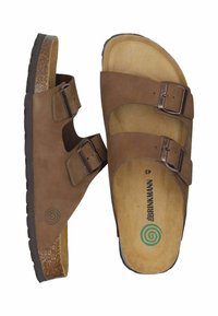 Sandales en cuir marron avec deux boucles réglables, semelle en liège et semelle en caoutchouc texturé. Présente un logo en spirale sur la semelle intérieure.