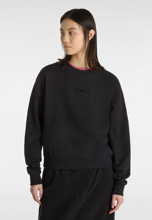 Black sweatshirt made of cotton blend, featuring a crew neckline, ribbed cuffs, and an embossed logo on the front. Soft texture.
