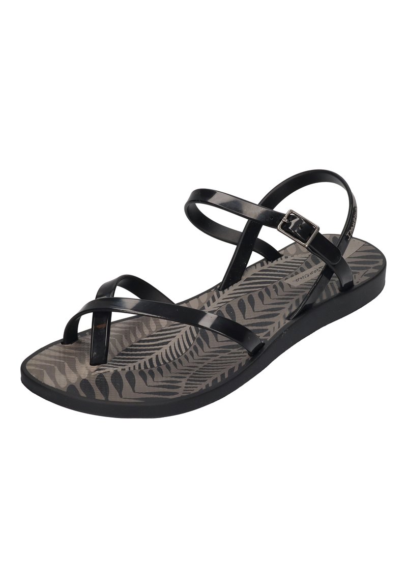 Black sandals with multiple glossy straps, featuring a textured grey insole with a fern pattern. Adjustable buckle closure on the side.