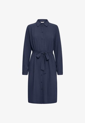 Tumši zilas krāsas krekla kleita, izgatavota no teksturēta auduma, ar apkakles kakla izgriezumu, pogu priekšpusi, garām piedurknēm un sasietu jostas jostu.