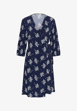 Abito avvolgente floreale blu navy con maniche a tre quarti, caratterizzato da motivi di fiori bianchi e un dettaglio con fiocco in vita. Tessuto dalla trama liscia.