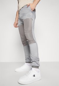 Ellesse SOPRANZI PANT - Donji dijelovi trenirke - grey