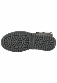 Semelle en caoutchouc avec une surface texturée présentant des motifs en triangles, de couleur gris foncé. Conception robuste avec un profil audacieux pour une meilleure adhérence.