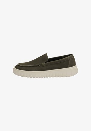 Dark green suede slip-on shoe with white thick ridged sole, rounded toe, and low heel.