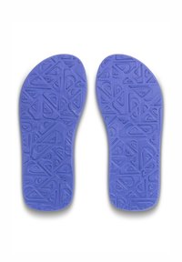 Paarse inlegzolen met een textuur van een geometrisch patroon, ontworpen voor comfort. Gemaakt van flexibel materiaal, gevormd om te passen in standaard schoenmaten.