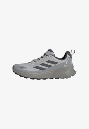Lightweight hiking shoes in gray with black accents. Features a breathable mesh upper, textured sole, and reinforced toe cap.