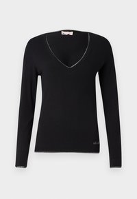 Maglione nero a maniche lunghe con scollatura a V. Presenta filato argentato lungo il colletto e l'orlo. Realizzato in un morbido tessuto testurizzato.