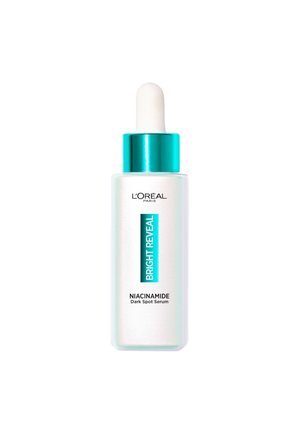 Sérum anti-taches à la niacinamide de L'Oréal Paris dans un flacon en verre dépoli avec un capuchon turquoise, doté d'un compte-gouttes blanc et d'un texte bleu sur l'étiquette.