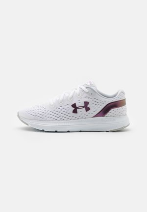 White athletic shoe with perforated upper, dark Under Armour logo, and purple detail on heel, shown from the side on a plain background.