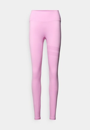 Rosa leggings med høy midje, laget av glatt stoff. Har tre horisontale striper i en strukturert detalj på venstre ben.