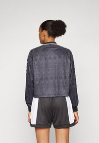 Champion SPORT HERITAGE LONG SLEEVES V NECK - Hosszú ujjú felső - black