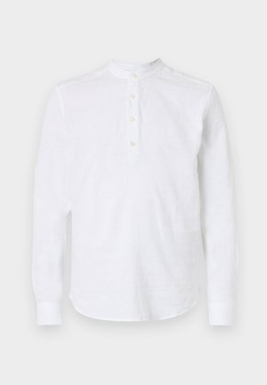 Camicia bianca a maniche lunghe in lino, con colletto alla cinese, patta con cinque bottoni e orlo curvo. Tessuto liscio senza motivi.