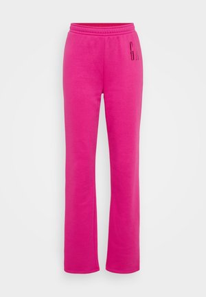 Pantalones de chándal rosas con cintura elástica, corte recto y gran logotipo impreso de "G" en el muslo izquierdo. Tejido de mezcla de algodón suave.