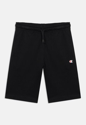Fekete, térdig érő rövidnadrág rugalmas derékpánttal és húzózsinórral, bal combon kis Champion logóval.